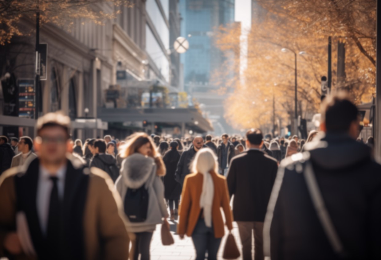 Crowd of pedestrians on a city street in autumn