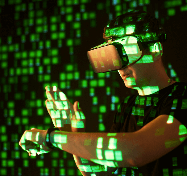 Person with VR headset looking at green hologram wall