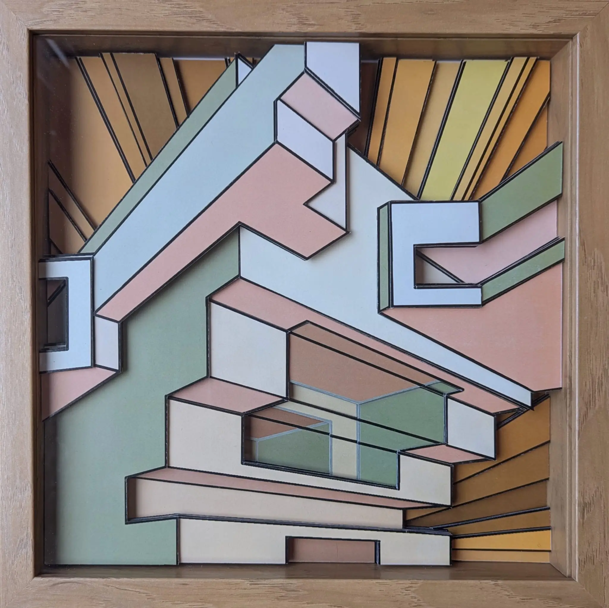 Relief géométrique pastel aux volumes imbriqués vert, pêche et blanc dans un cadre bois, évoquant une architecture abstraite lumineuse.