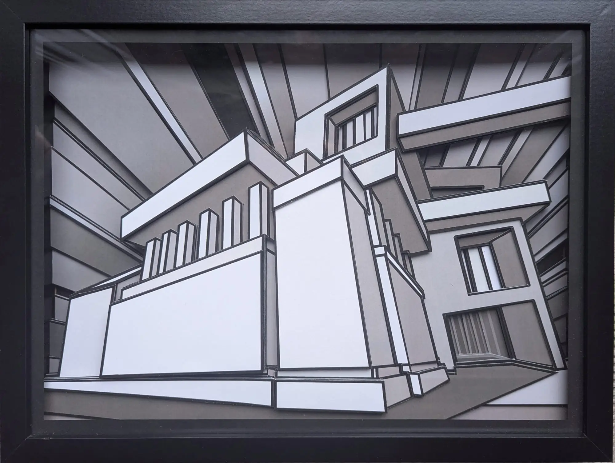 Relief géométrique noir et blanc, volumes superposés et lignes angulaires, profondeur architecturale.