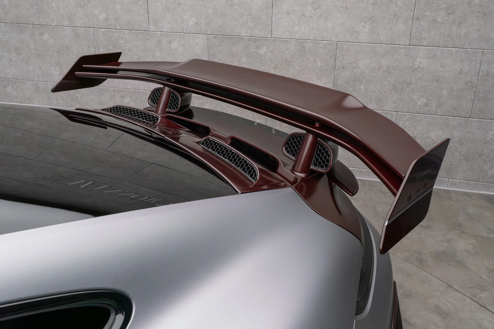 Mansory Porsche 911 Turbo S 992.2 — two-piece rear spoiler detail