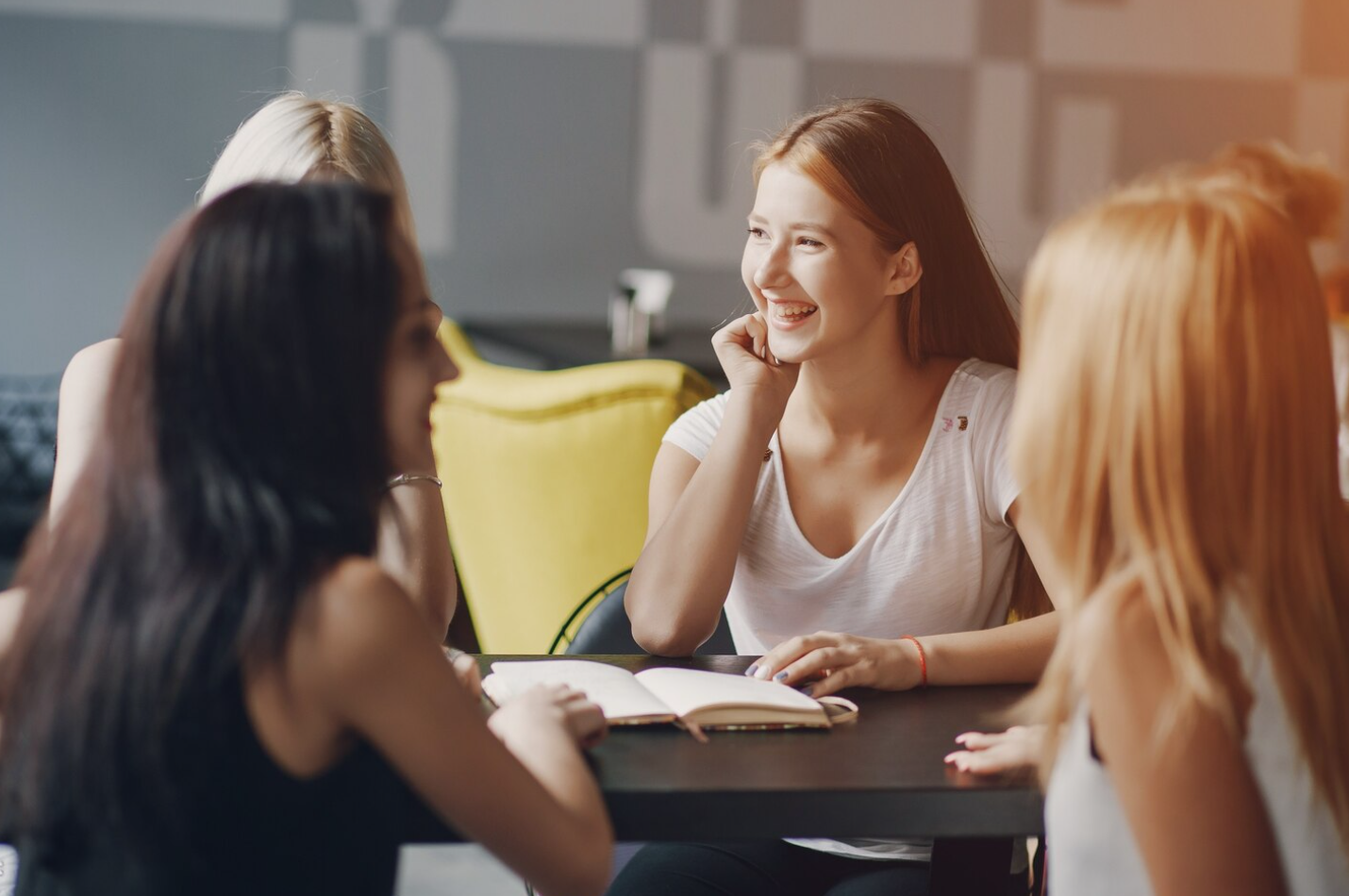 A group of four women attending an addiction treatment center covered by OHP