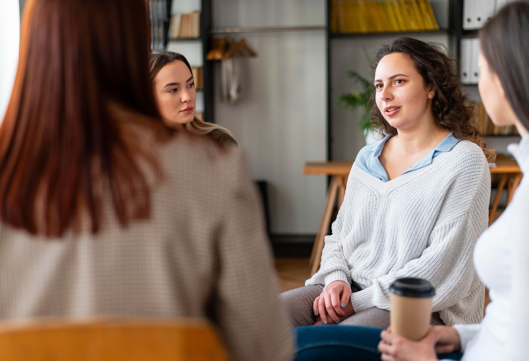 People participating in a counseling session, reflecting the role of therapy and peer support in treating co-occurring substance use and mental health challenges