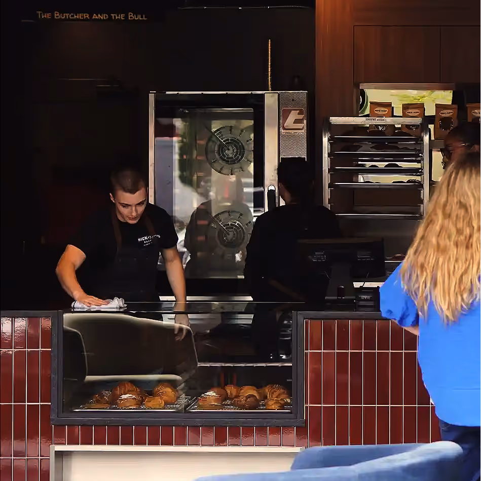 Nick + Sons Baker making bread.