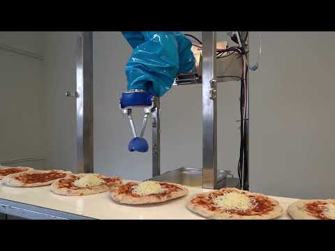 Chef robot assembling pizza