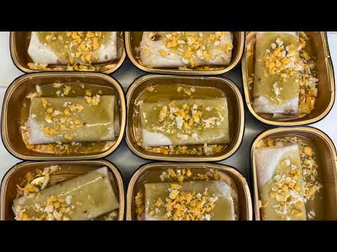 Chef robot assembling smothered burritos