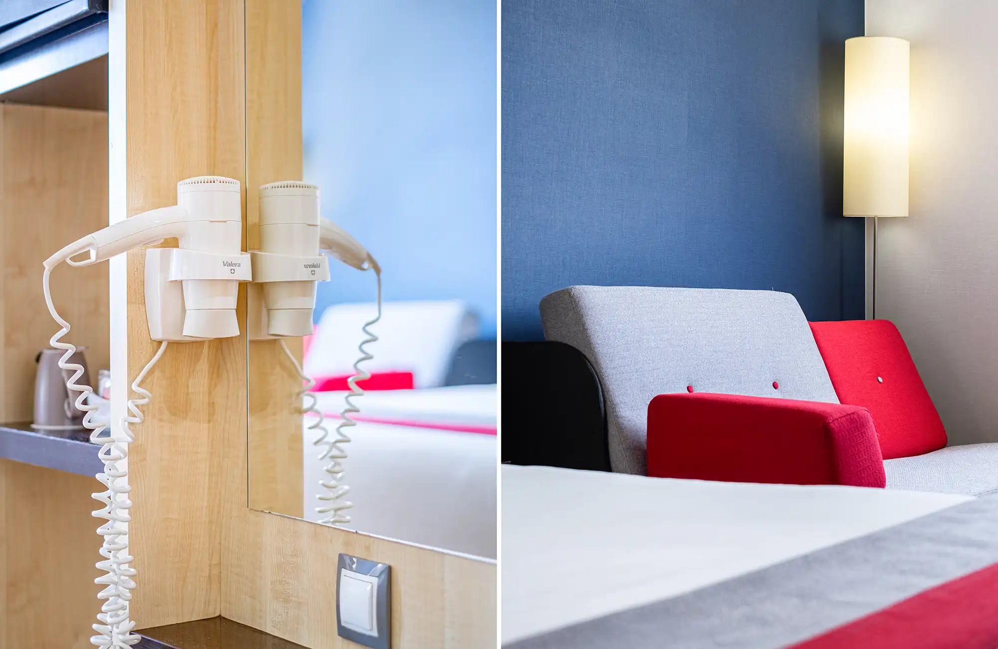 Teléfono de habitación y cama de hotel con cojines en tonos rojo, blanco y azul