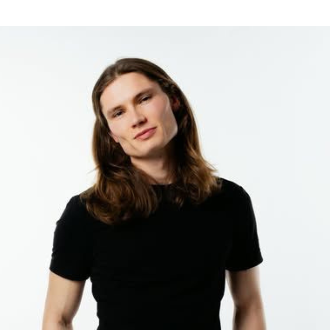 A profile picture of a man with long hair looking at the camera.