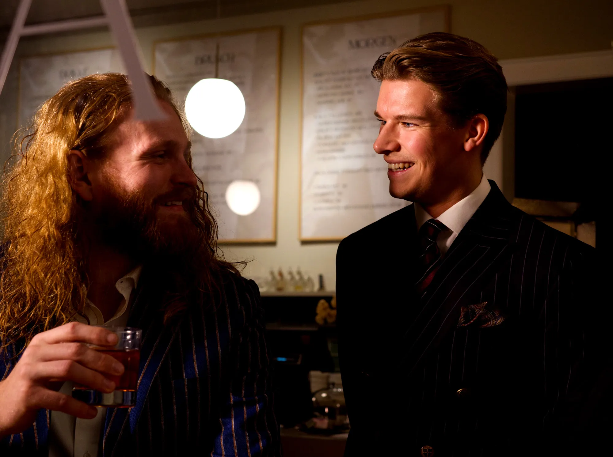 men in suits cheering