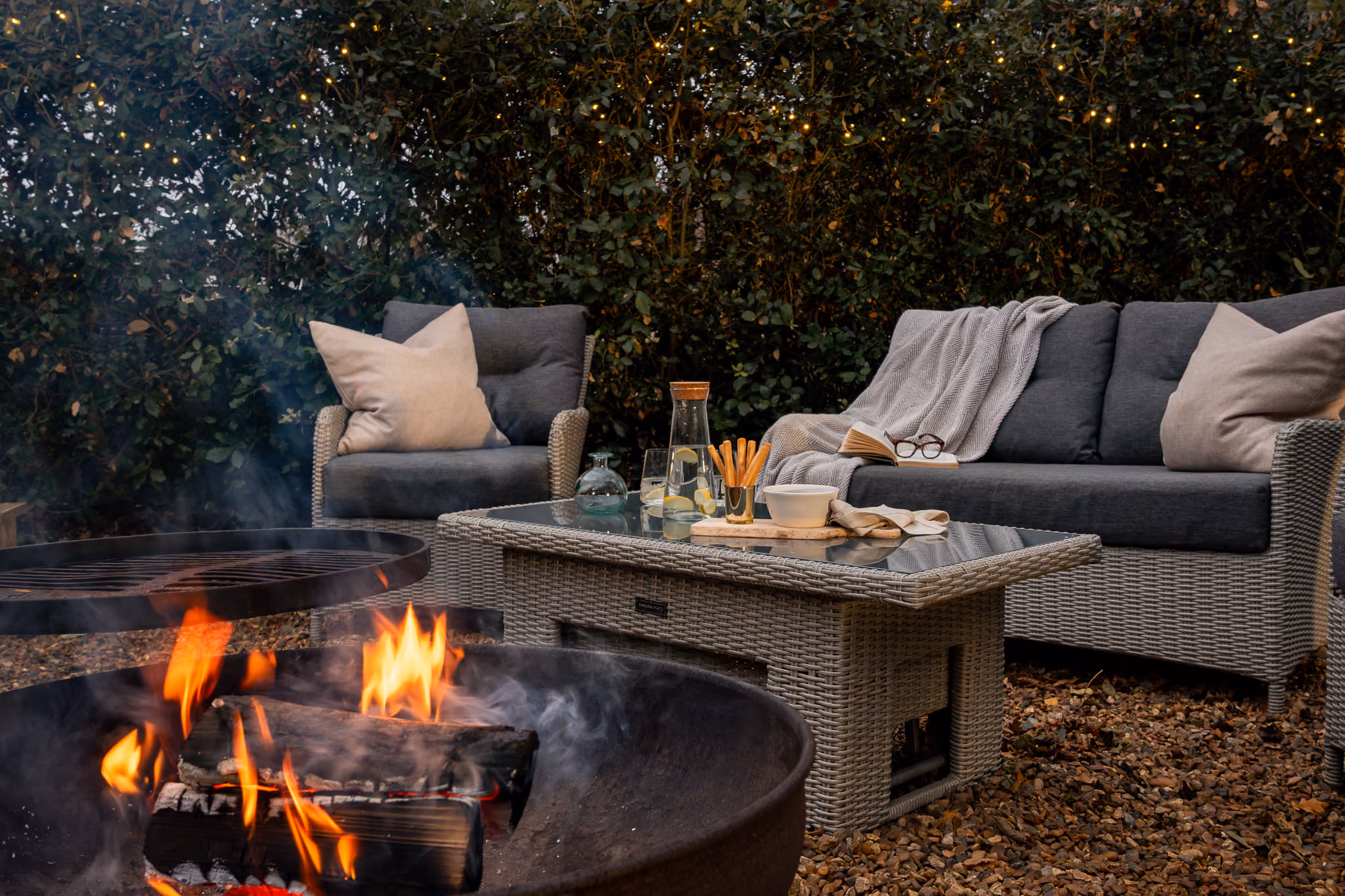 Exterior glamping with fire pit and blankets