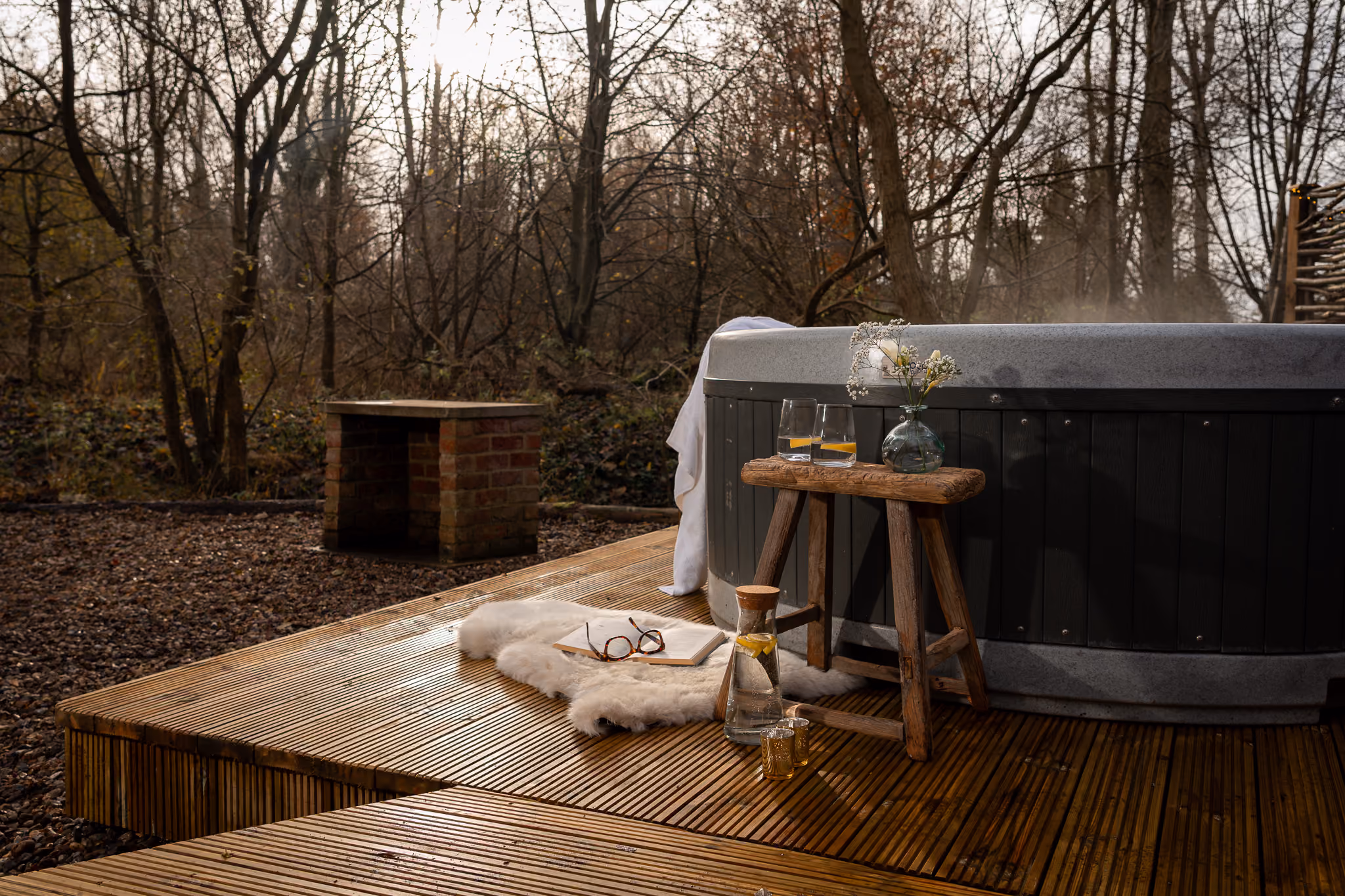 Steaming hot tub with woodland views