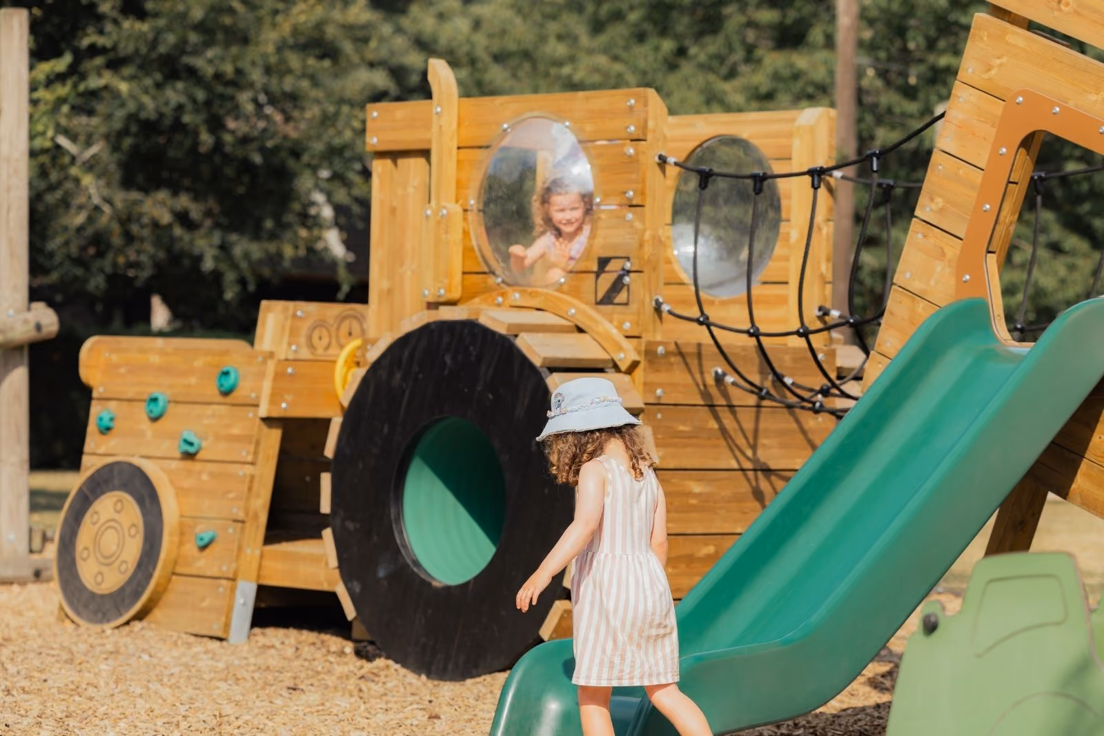 Children playing on Charlie the tractor