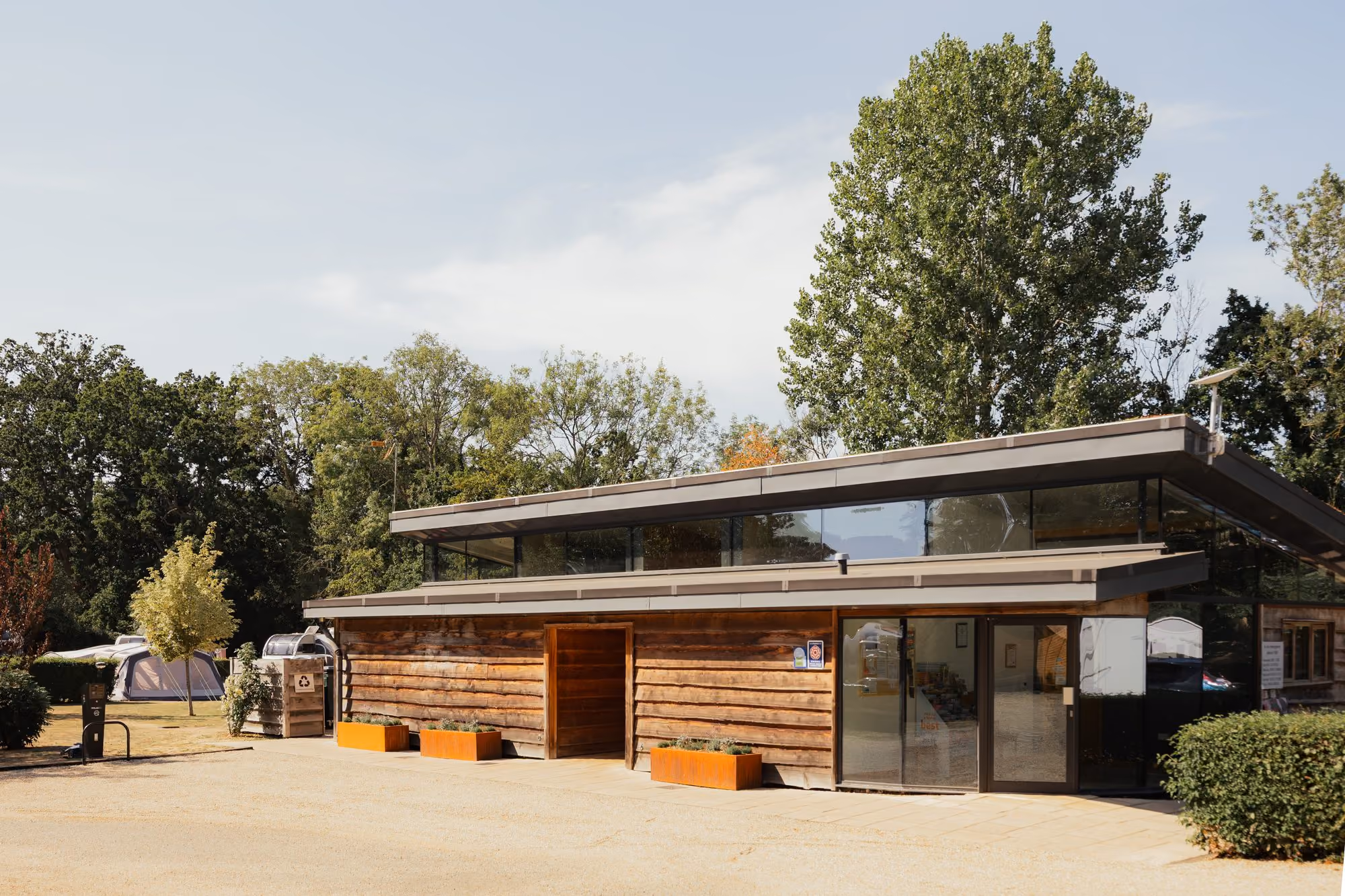 Timber-clad facilities building at Deer’s Mead.