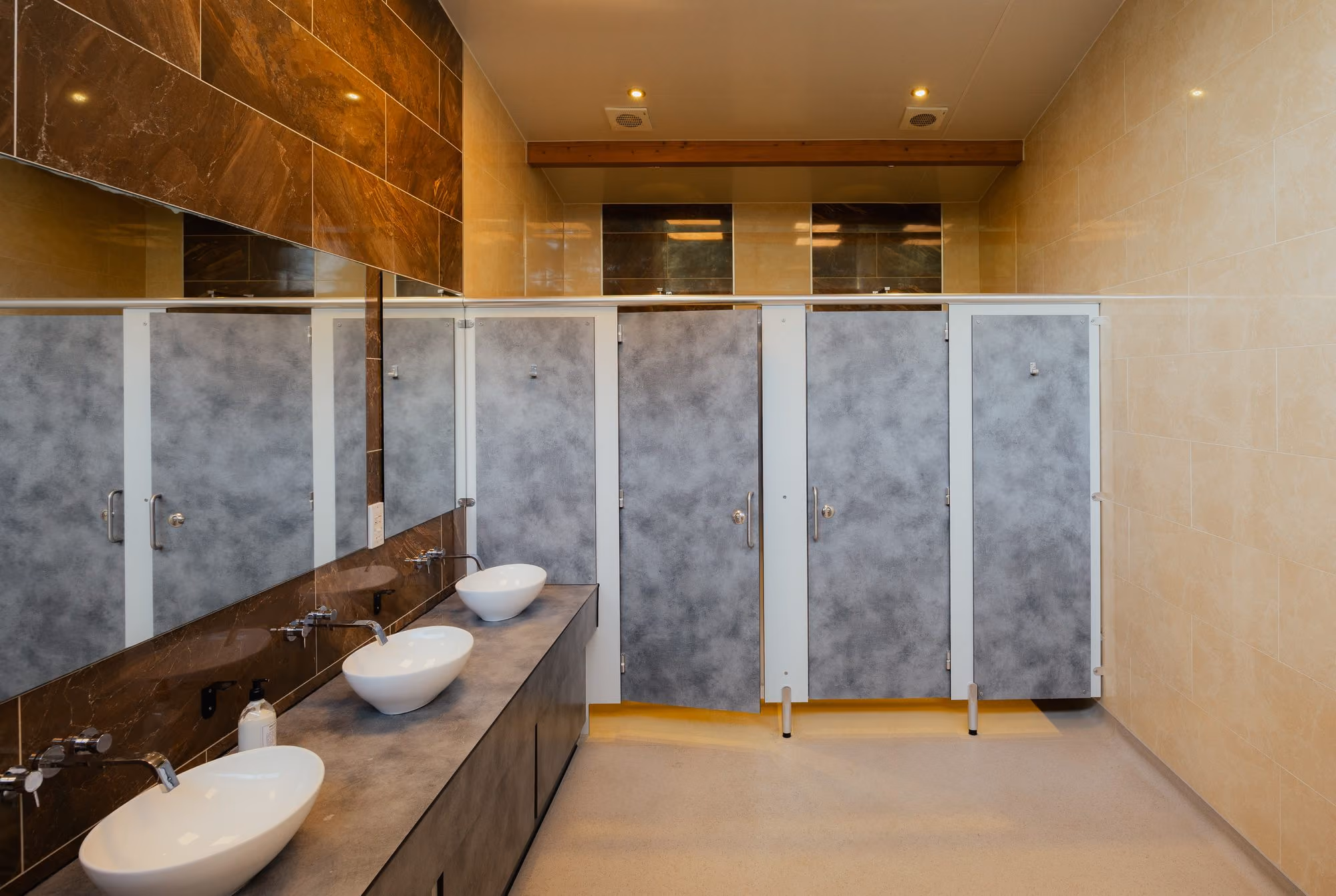 Modern washrooms with sinks and toilet cubicles at Deer’s Mead.