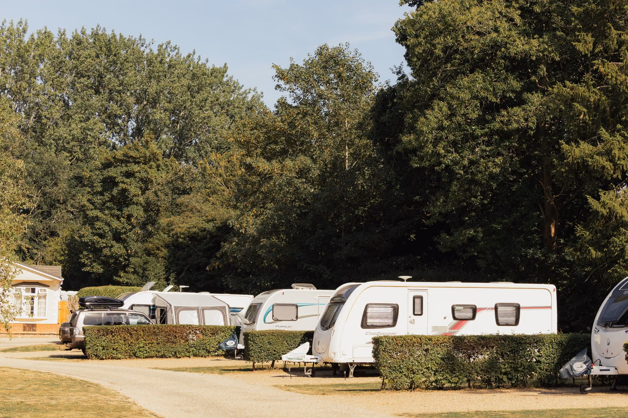 Caravans on spacious, hedge-lined pitches at Deer’s Mead.