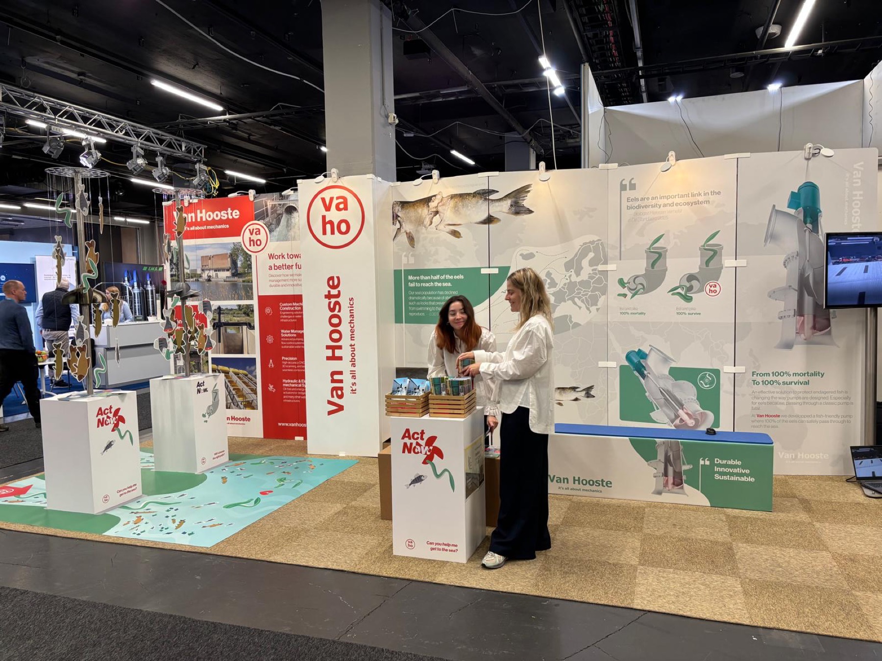 Trade show booth for Van Hooste showcasing fish-friendly pump solutions and environmental conservation displays