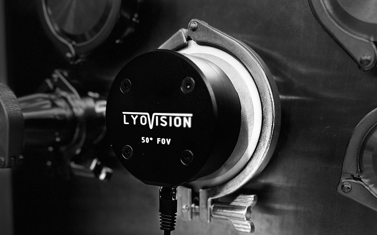 LyoVision 50 degree camera clamped to a sanitary port on a freeze-dryer, with a single ethernet cable