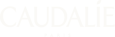 Logo Caudalie Paris en texte blanc sur fond transparent.
