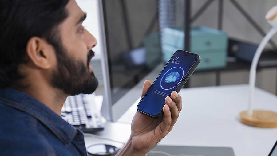 A person speaking to an AI assistant on a smartphone.