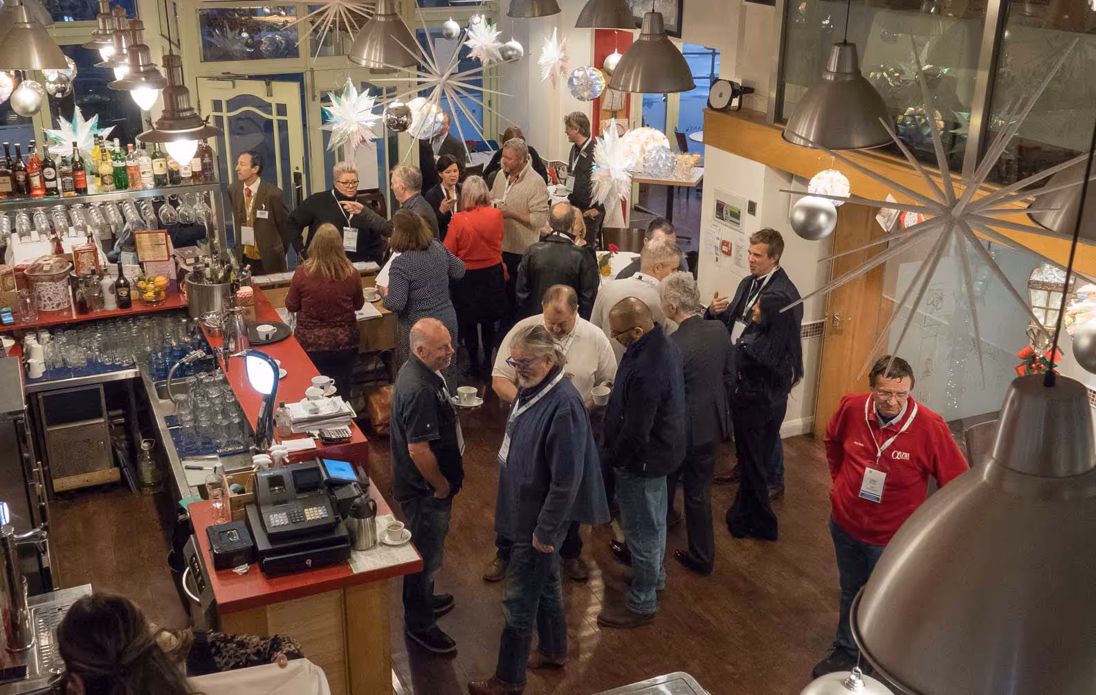 A group of people standing in a room.