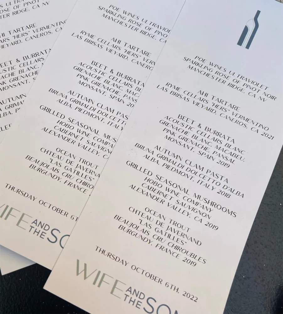 Printed menu featuring wine pairings and dishes including ahi tartare, beet & burrata, autumn clam pasta, grilled seasonal mushrooms, and ocean trout, dated Thursday, October 6th, 2022.