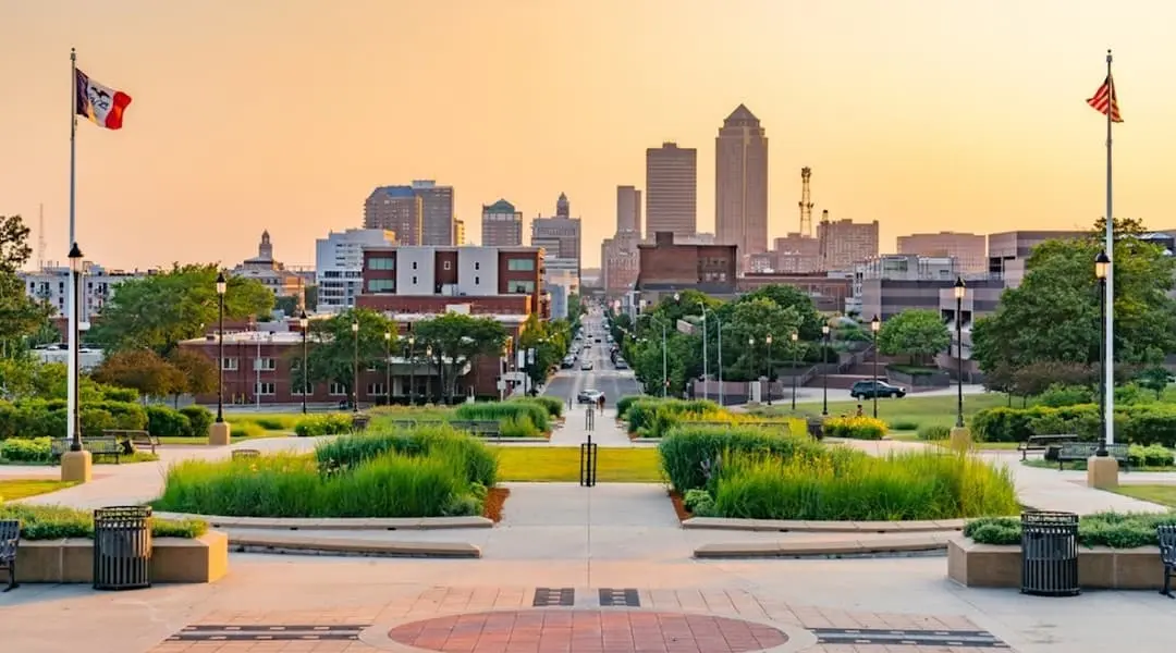 Iowa cityscape showing the Des Moines skyline and downtown corridor at golden hour, highlighting the state’s capital city.