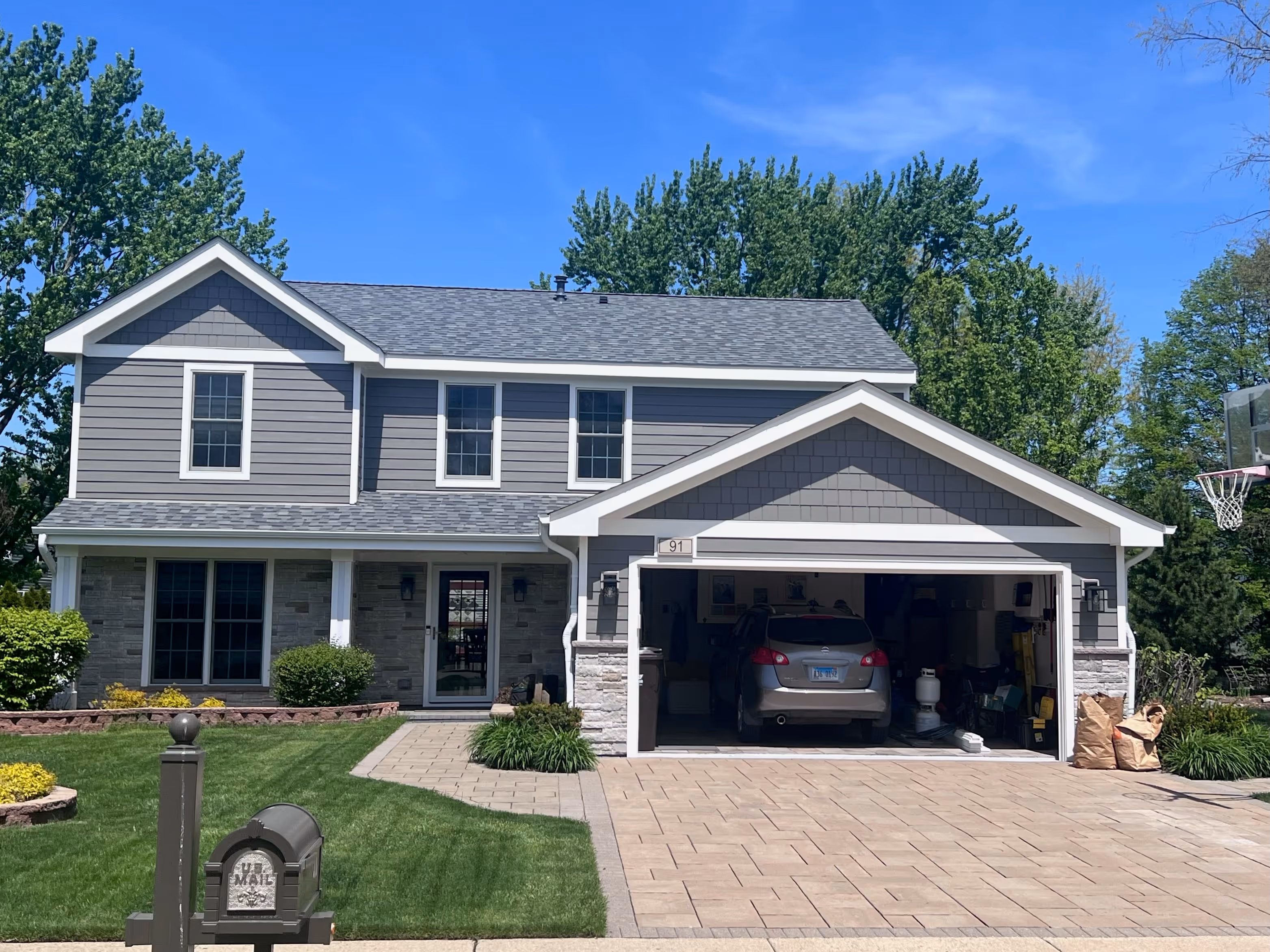 A car is parked in the garage of a house.