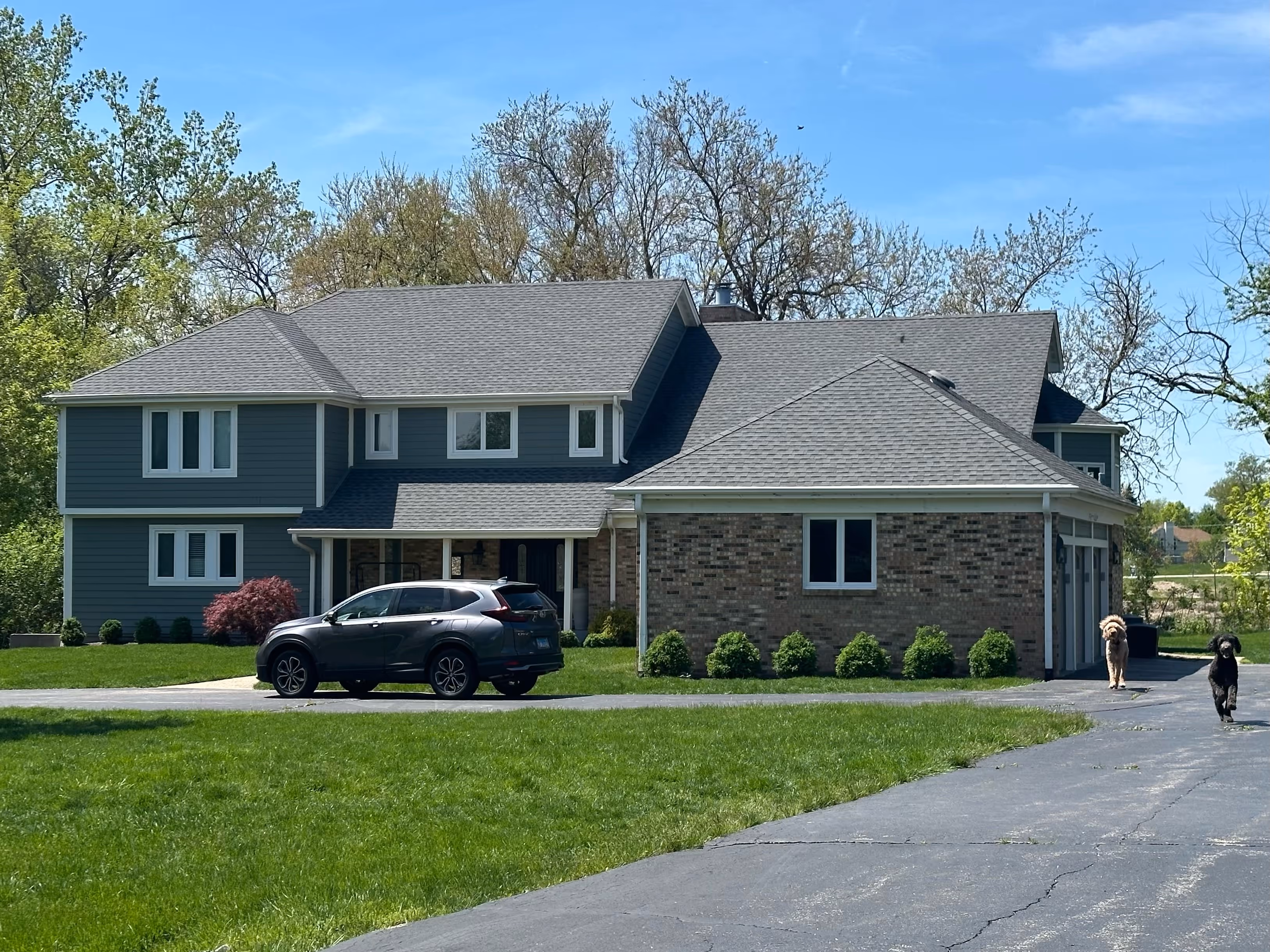 A car is parked in front of a house.