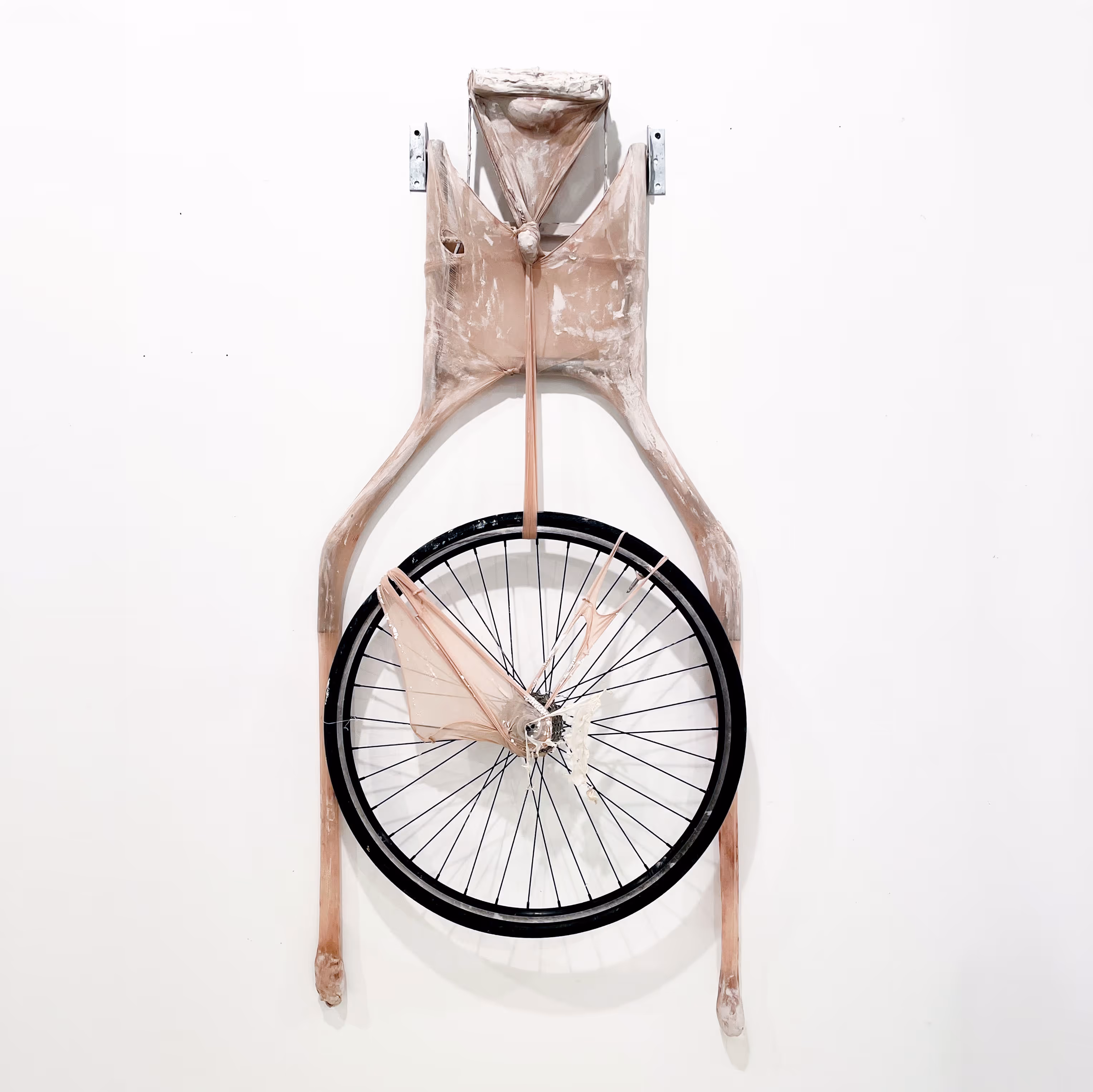 Erika Choe, 'Dead Weight between my Legs', 2025, Mixed-media Sculpture, Nylon, clay, metal structure, bicycle wheel, plaster, latex, 48x30x3".