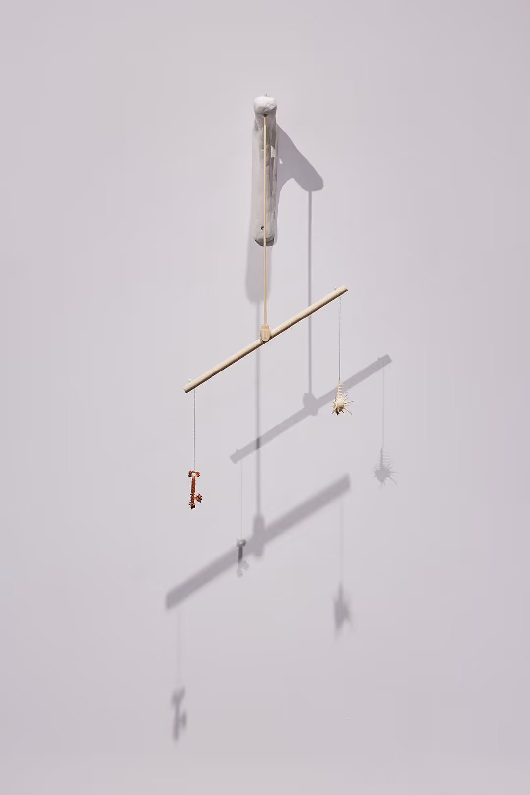 Jill Smith, 'judgement', 2024, copper-plated key, murex sea snail shell, plywood, ash, Winterstone Sculpting Mix, wire, metal jewelry chain, freshwater pearl, plastic pearl, 15”L x 12”D x 35”H.