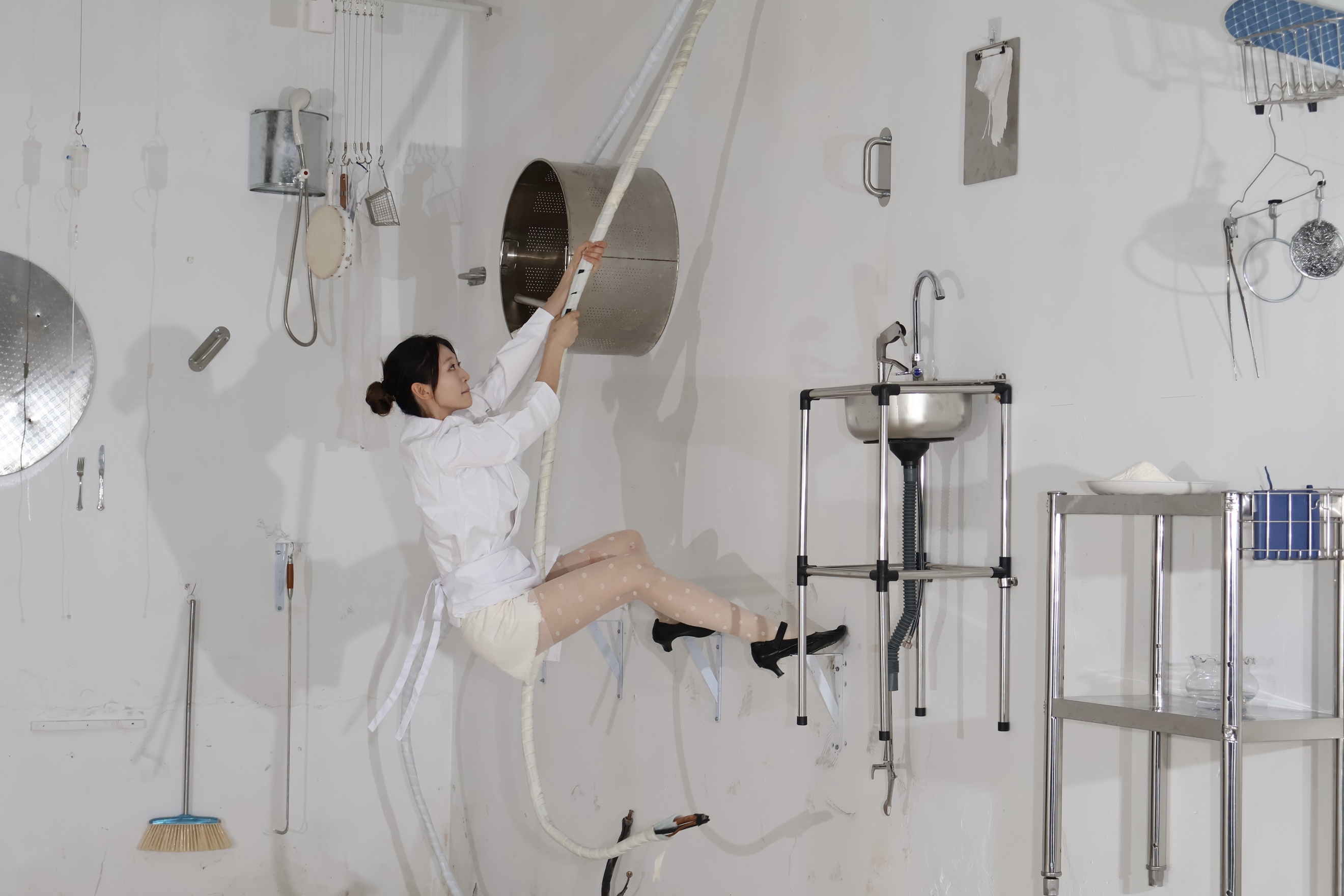 Zixi Wang 'Kneading' 2026. Steel, stainless steel, dough, found objects, flour, live performance. Installation: 315 × 315 × 237 