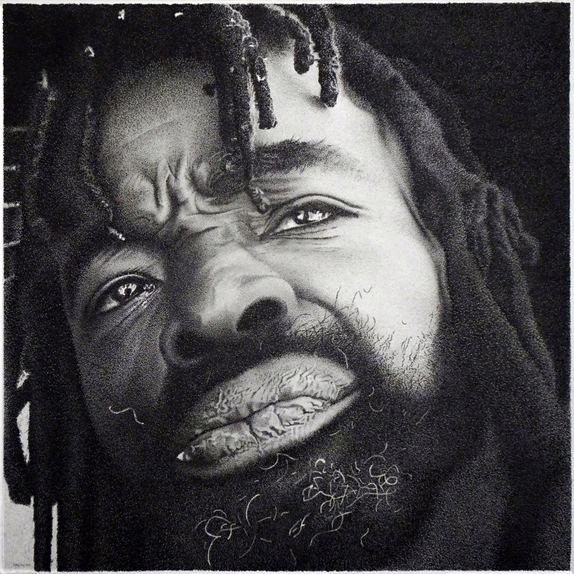 Work by Richard Masters: detailed black-and-white drawing, close up, of a bearded man with locs and a furrowed brow looking up at the viewer.