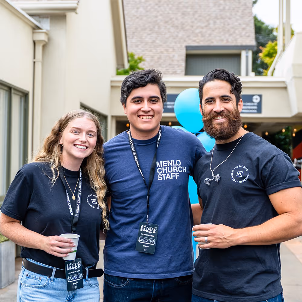 Three Menlo staffers smiling at camera.