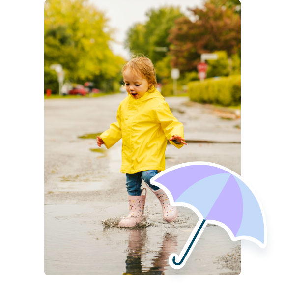 Child playing in the rain with umbrella