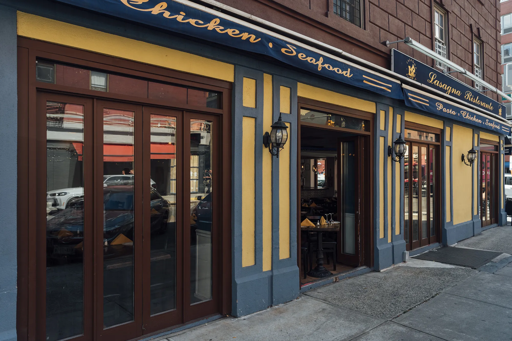 A sidewalk featuring a signboard displaying information or promotions for pedestrians passing by.