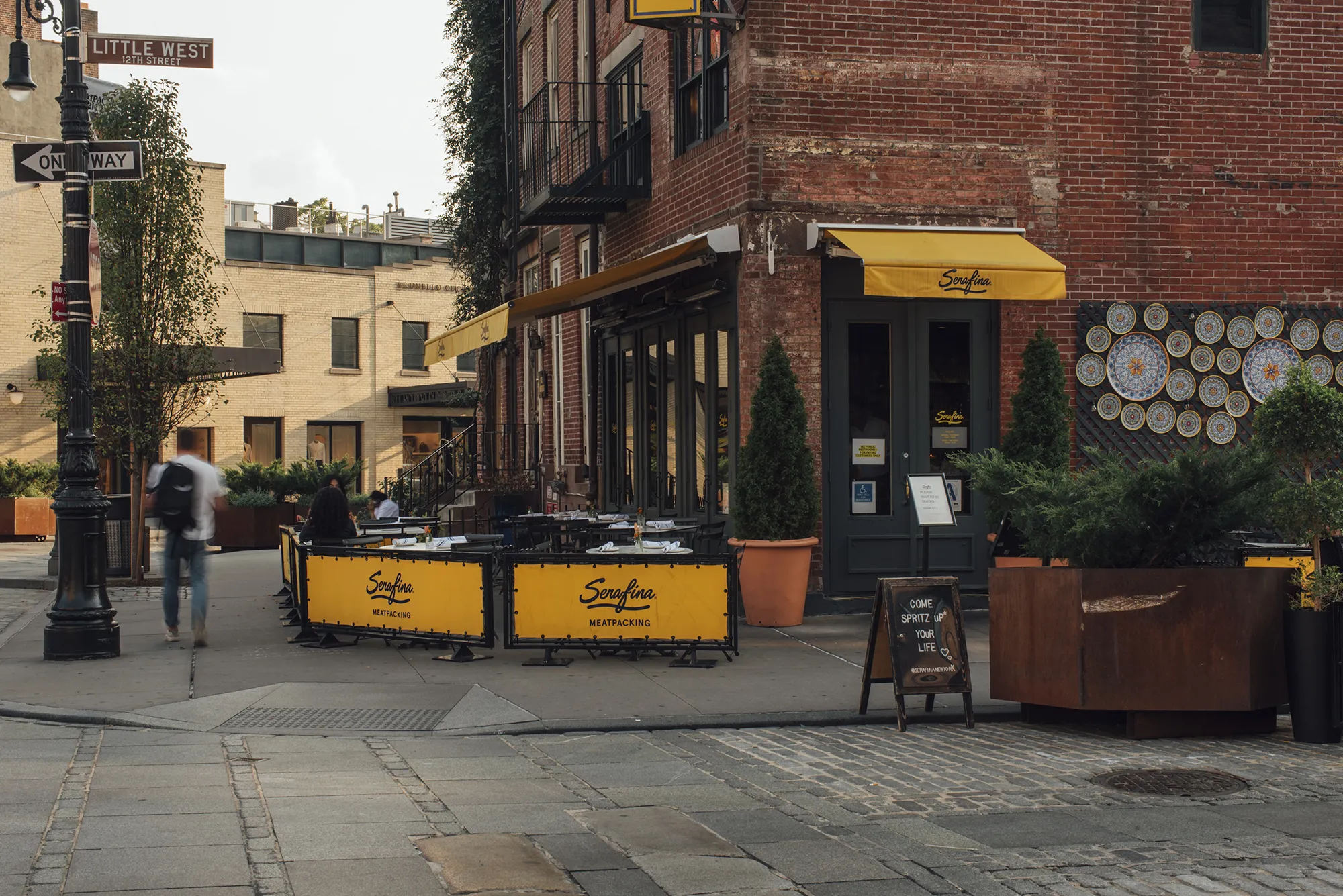 A close-up view of a brick sidewalk, showcasing the textured red and brown bricks arranged in a neat pattern.