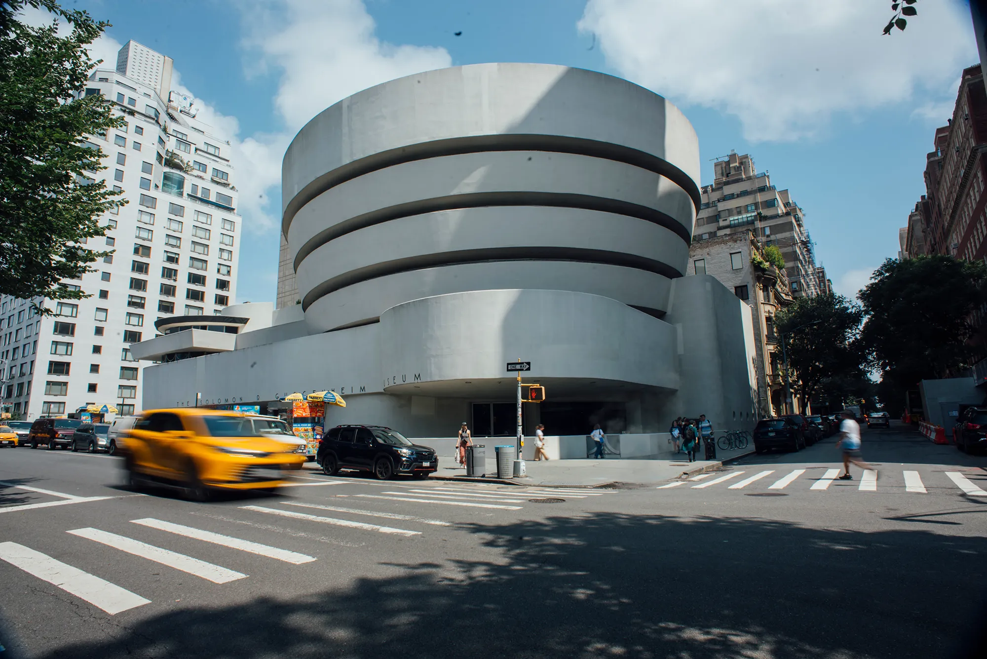 A bright white building is featured, showcasing its clean and modern design.