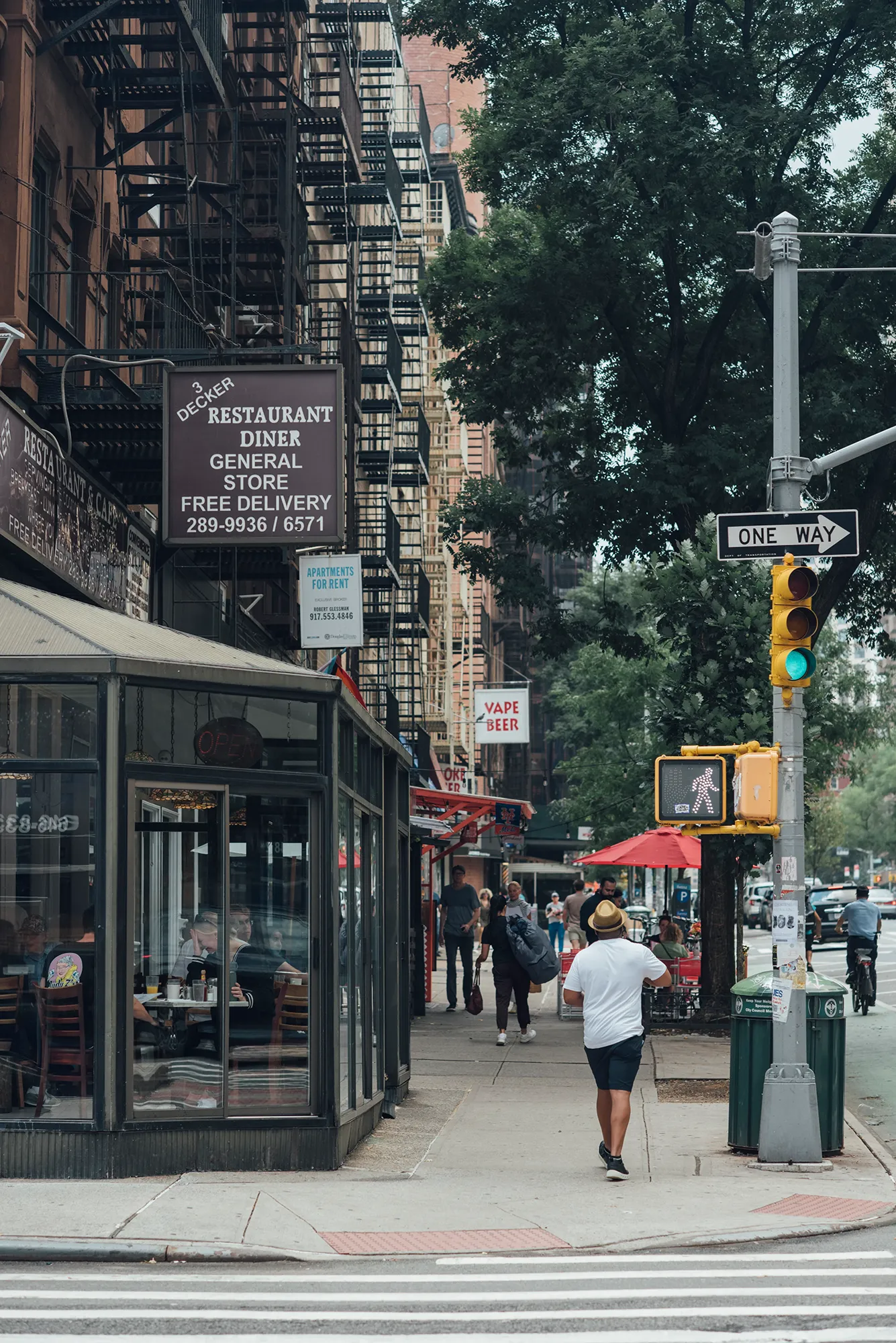 A street scene featuring a marked crosswalk for pedestrian use.