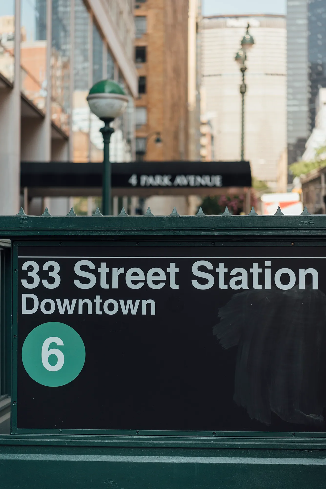A sign displaying "33 Street Station Downtown" in clear, bold letters against a neutral background.