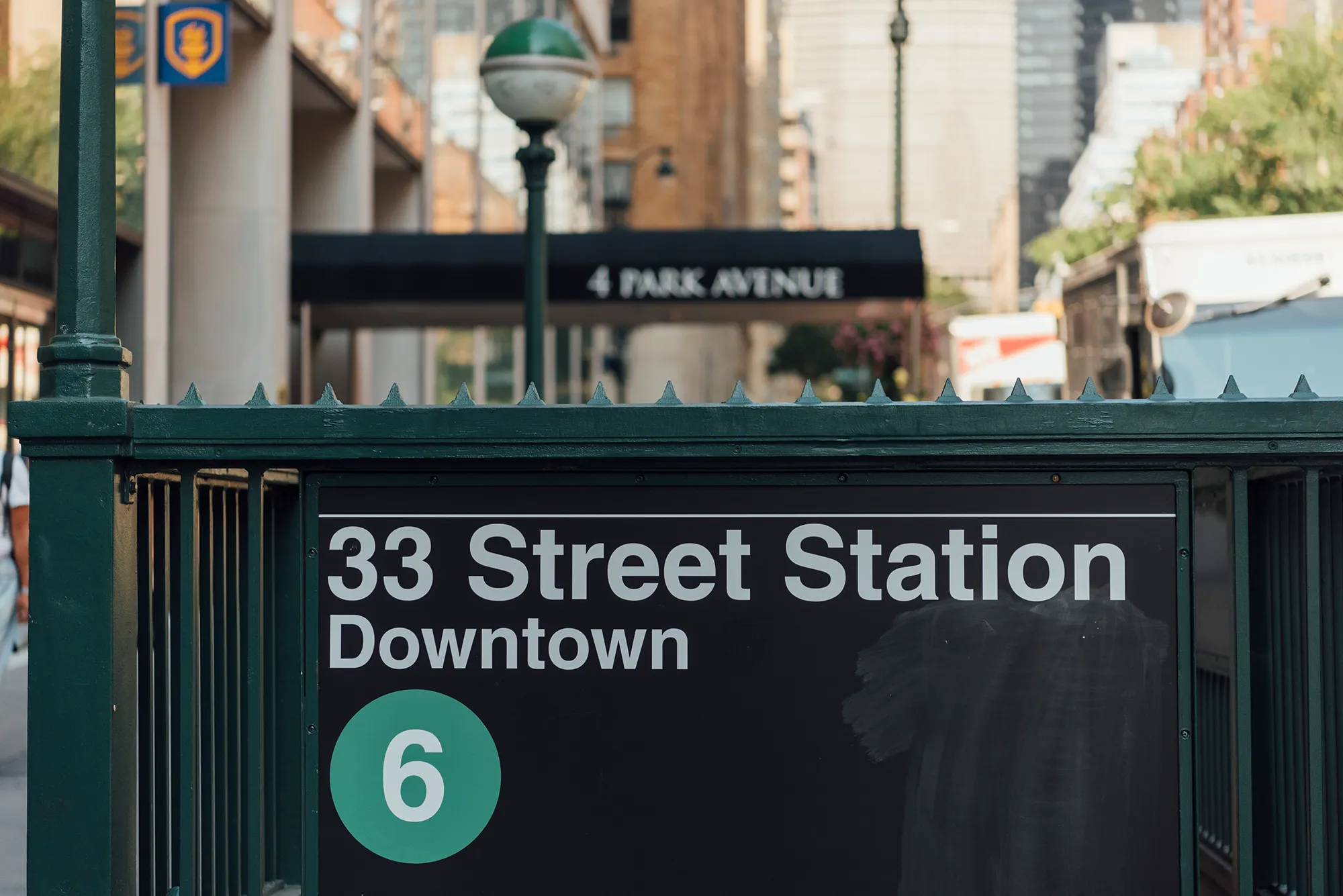 A sign displaying "33 Street Station Downtown" in clear, bold letters against a neutral background.