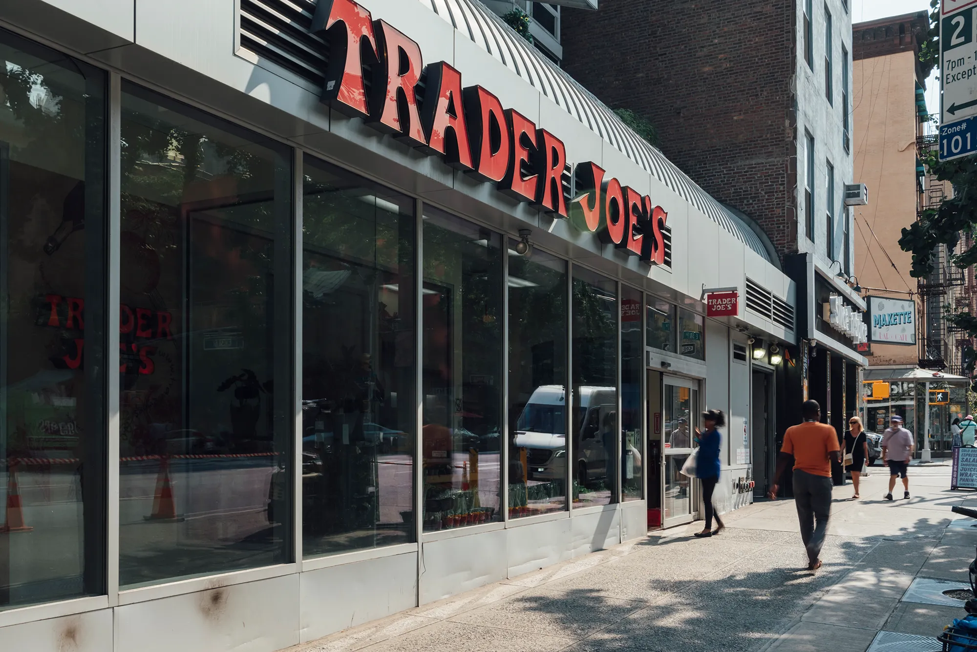 A building exterior featuring a prominent sign displaying its name or purpose.