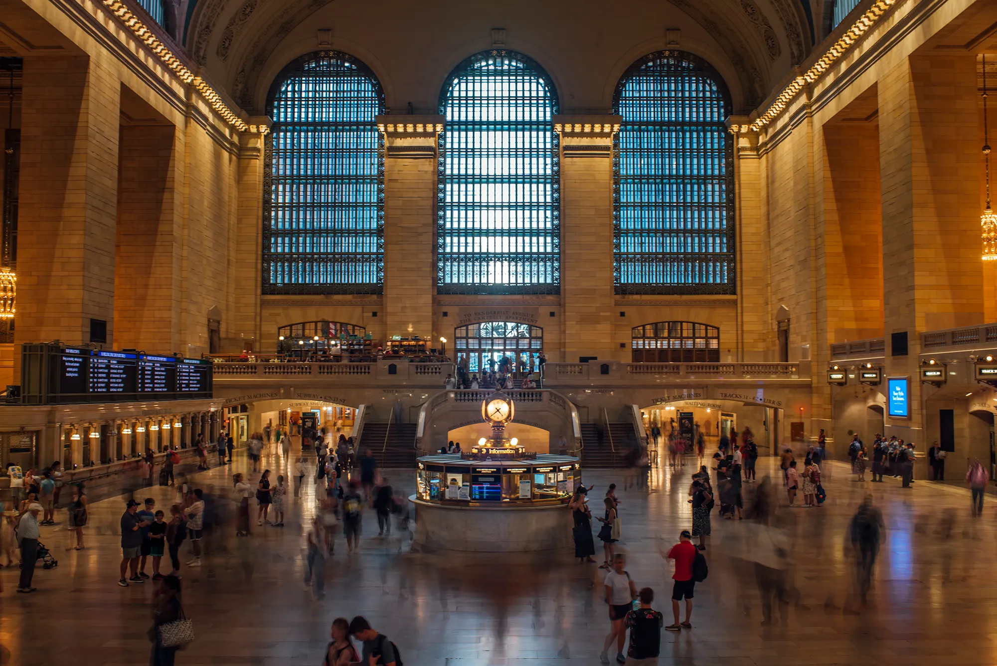 A large building filled with numerous people engaged in various activities inside.