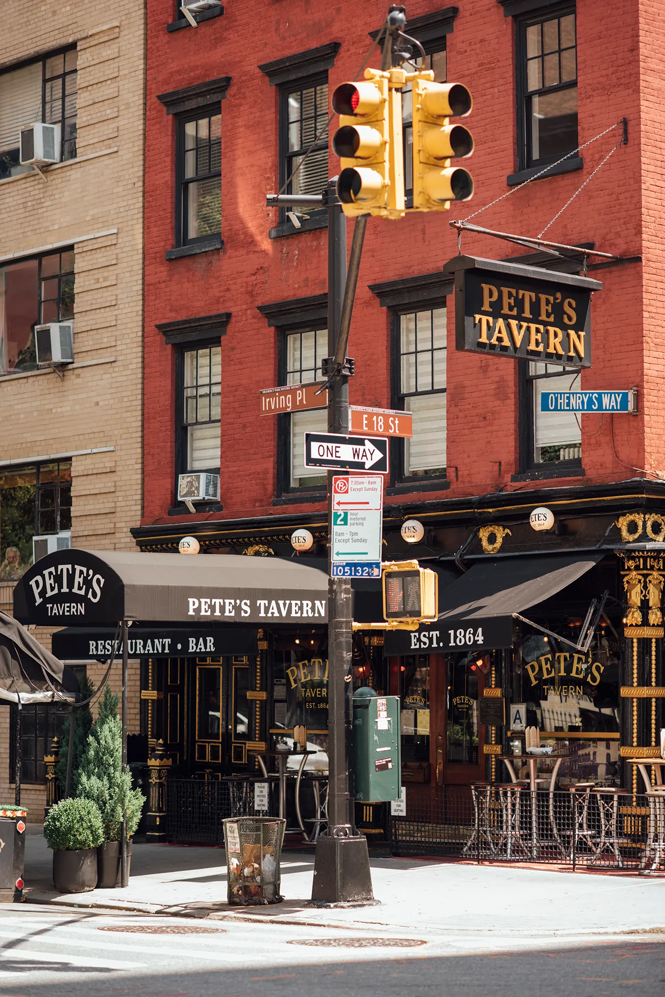 A red brick building with a classic architectural design and large windows.