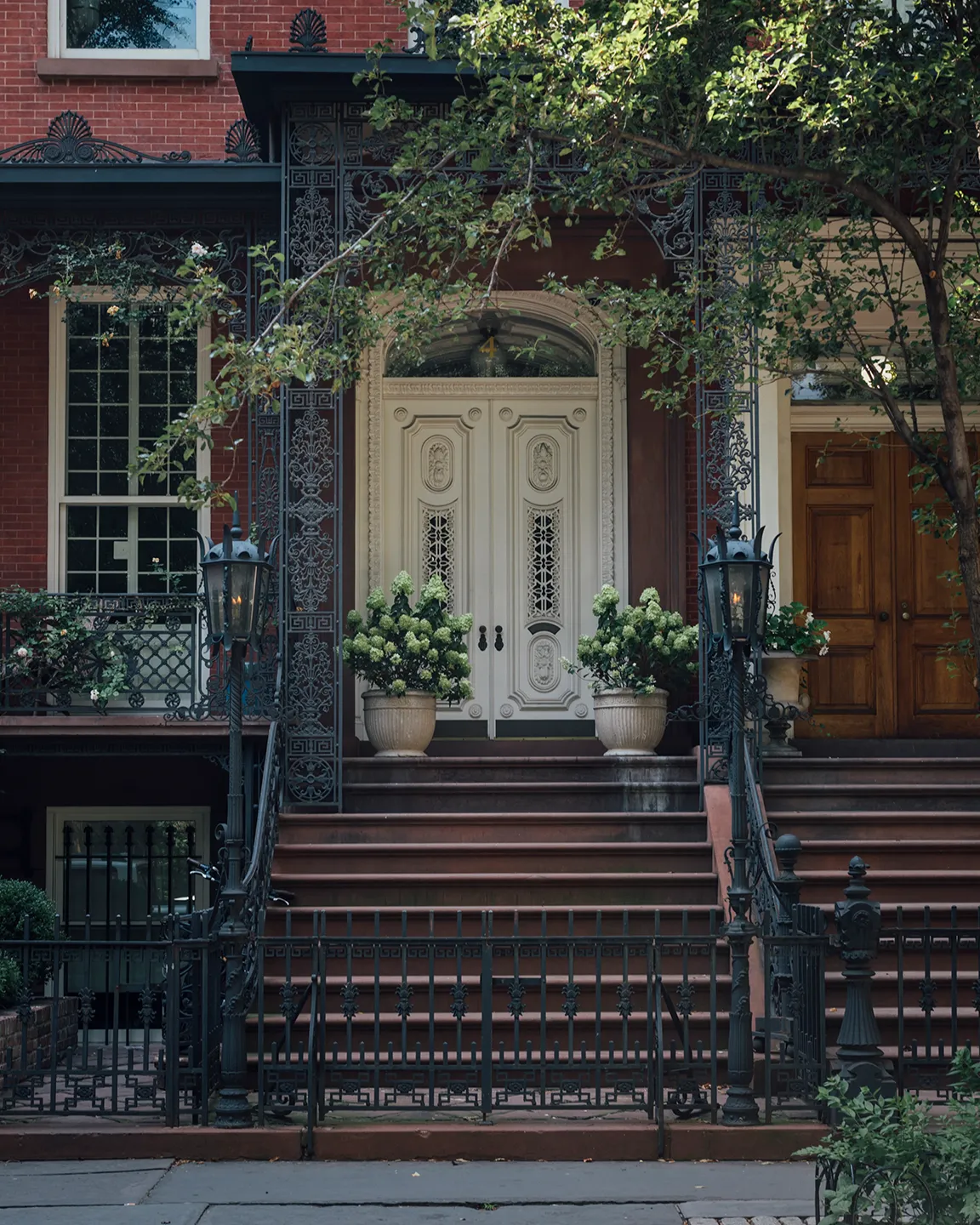 A decorative black wrought iron fence, featuring elegant patterns and a sturdy structure.