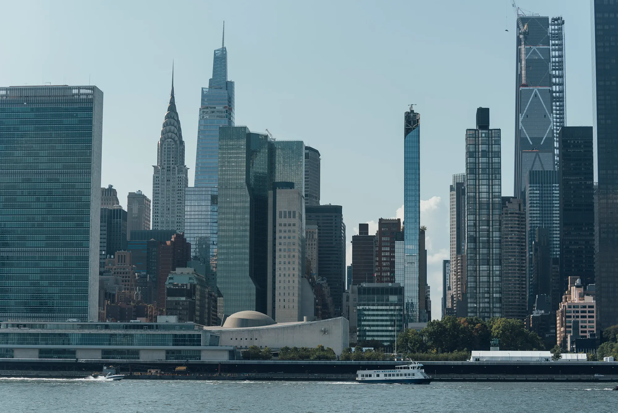 A large body of water stretches across the landscape, shimmering under sunlight.