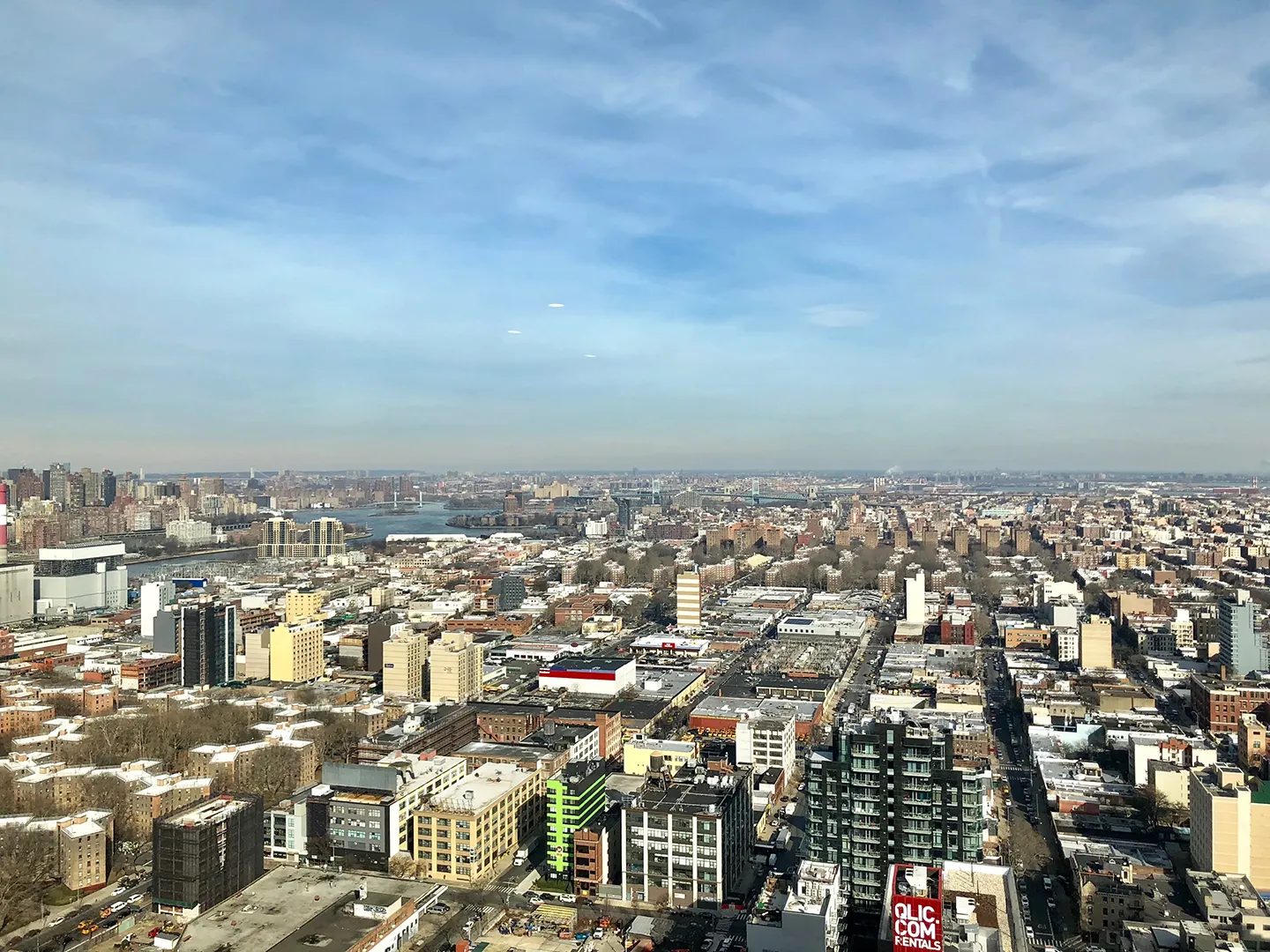 Aerial perspective from the Empire State Building, highlighting the vast New York City landscape and iconic structures.