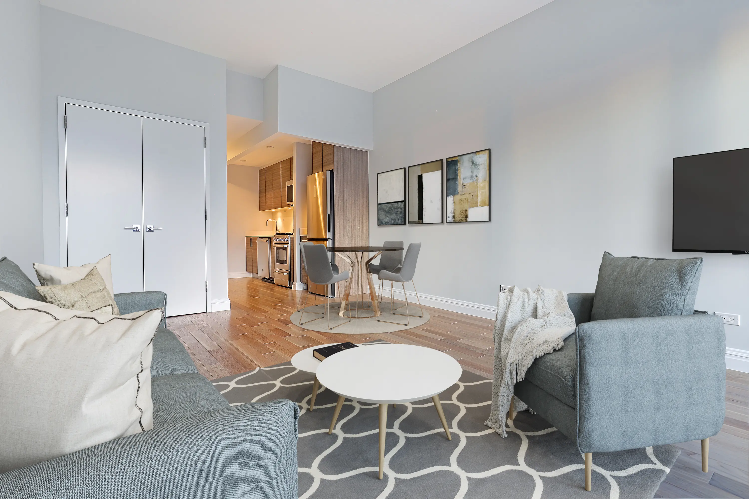 A stylish living room with a comfortable couch, an armchair, and a table, creating an inviting atmosphere.