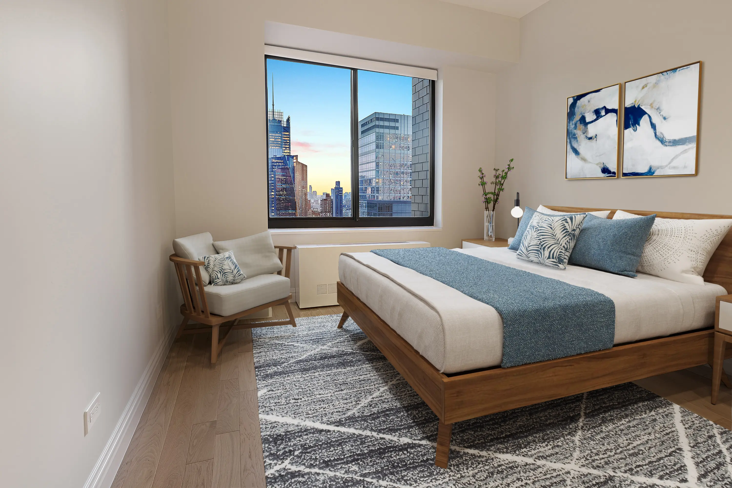A well-furnished bedroom showcasing a bed, a chair, and a window that enhances the room's natural lighting.