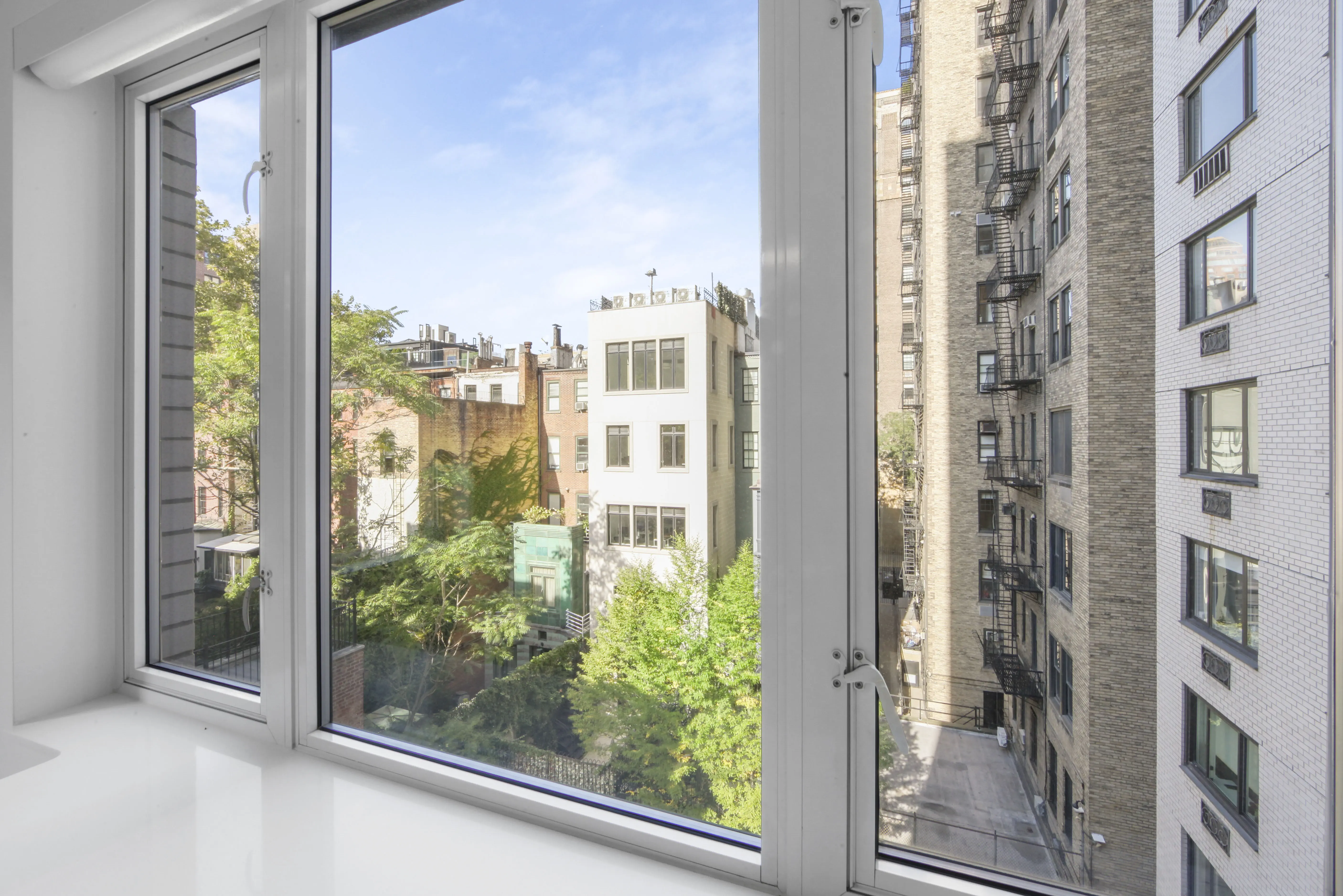 A window providing a scenic overlook of the urban landscape.