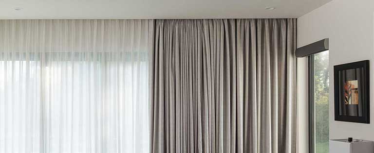 Motorized curtain system with modern neutral drapery
